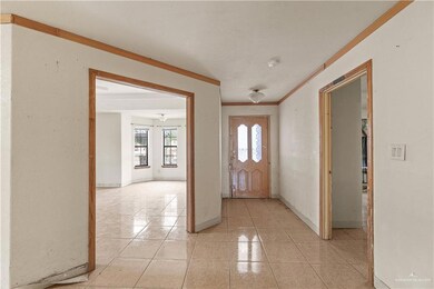 Entrance foyer featuring ornamental molding