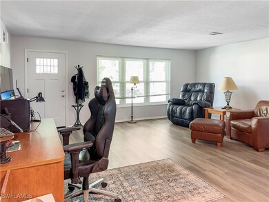 Office featuring light wood-type flooring, visible