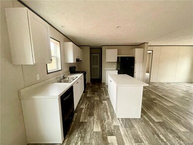 Kitchen from den/dining area