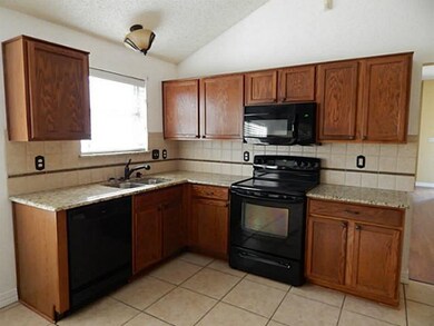 Kitchen with Kenmore appliances and ceramic tile f