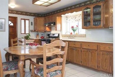 Kitchen has Corian counters, smooth ceilings, porc