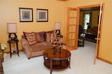 Living Room with a pair of oak french doors to lea