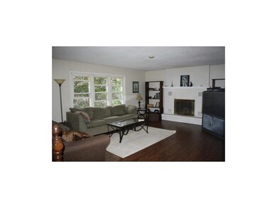 beautiful great room with wood floors and fireplac