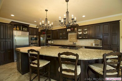 Kitchen with granite, rich wood cabinets, gorgeous