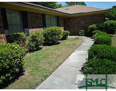 Exterior Front. WELL MANICURED BUSHES LINE THE SID