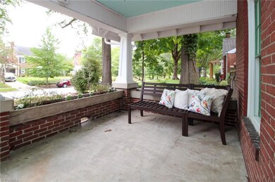 Custom window boxes surround entire porch.