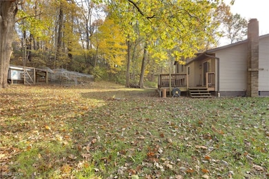View of green lawn with a deck