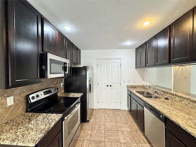 Kitchen featuring appliances with stainless steel