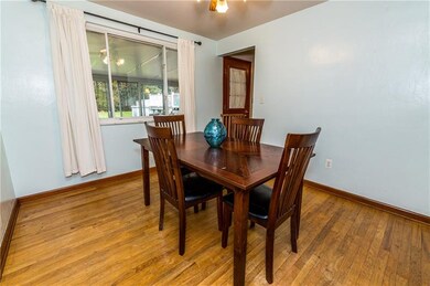 Gorgeous wood floors and an over sized window make