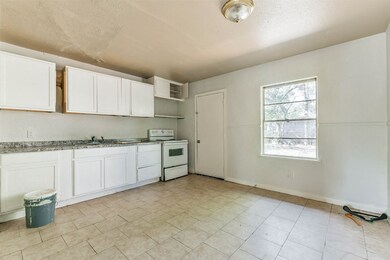 The kitchen is thoughtfully designed, featuring am
