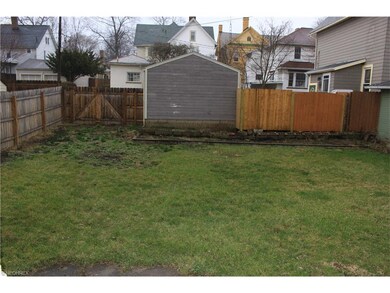 Back Yard.  Fence to the left of the neighbors gar