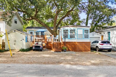 View of front of home featuring a storage shed and