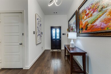 Foyer entrance featuring dark hardwood / wood-style floors
