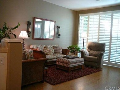 Living Room has Neutral Colors, Plantation Shutter
