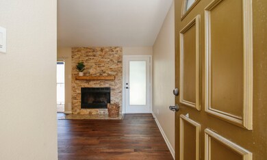 Neutral paint colors and warm LVP flooring run thr