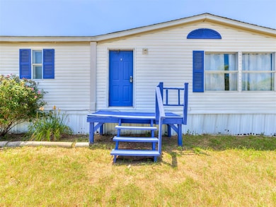 View of front of property with a front yard