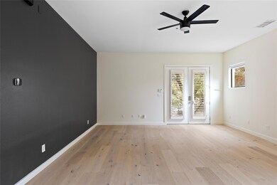 Spare room with ceiling fan, light wood finished 