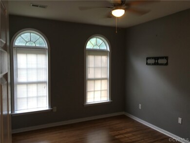 First floor Master bedroom with palladium windows, and new ceiling fan.