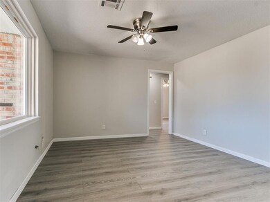 Spare room featuring a textured ceiling, light woo