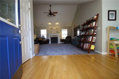Solid wood floors leads from the entry to the right and through the dining room (serving this owner as family room)