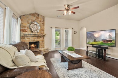 Family room has a view of the beautiful back yard.