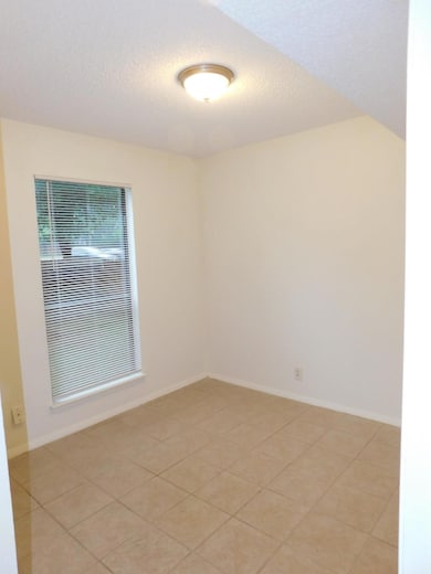 Spare room with a textured ceiling