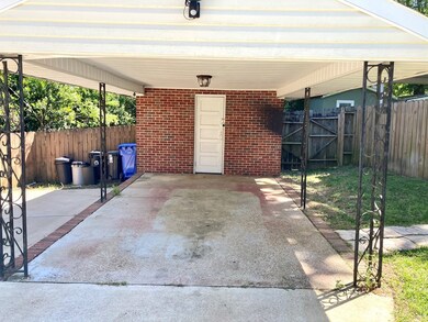 Carport with storage room