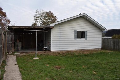 Detached garage with carport