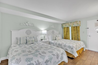 Bedroom with baseboards and wood finished floors