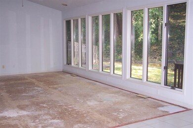 Spacious living room looking out to back yard and 