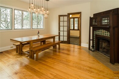 The stately dining room is sun-drenched and broad.