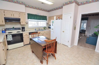 The kitchen comes equipped with a range/oven, dish