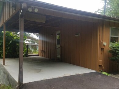 carport and entrance to house and deck