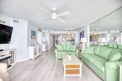 Living room featuring ceiling fan and light hardwo