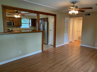 Living room looking into kitchen