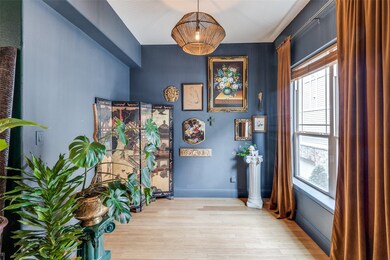 Corridor featuring light wood finished floors and baseboards