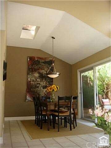 Dining room with architectural interest ceiling an