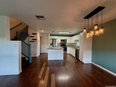 Open concept remodeled kitchen with dining area and living room.