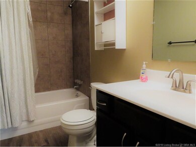 Updated bath with newer floor, vanity, lighting an