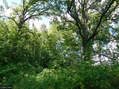 Heavily wooded with mature Oaks, Maples, Aspen, bi