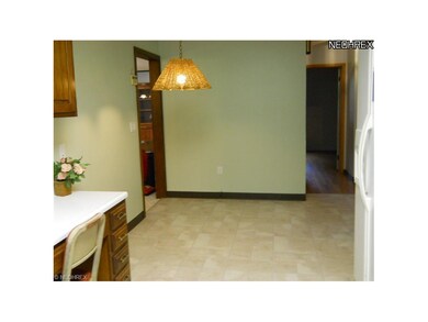 Eat-in kitchen with new flooring.