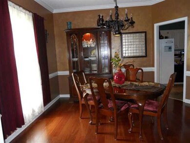 Lovely dining room is embellished with a dazzling 