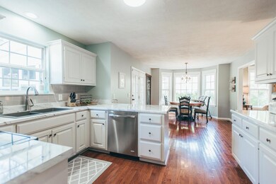 Large kitchen with all stainless steel appliances and beautiful backsplash!