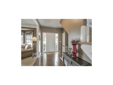 Entryway with hardwood floors.