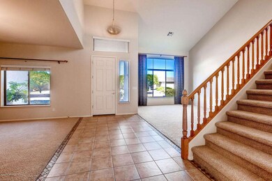 Tiled Entry and Maple Staircase