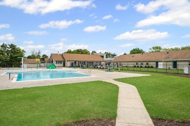 Community pool featuring a patio