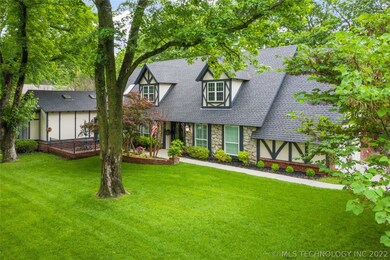 Charming brick courtyard in front of home with acc
