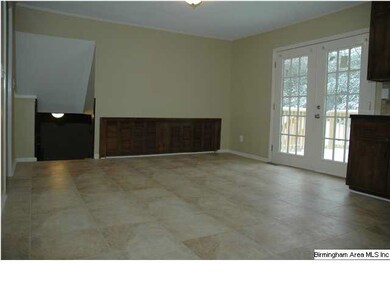 French doors to the deck and the stairwell down to