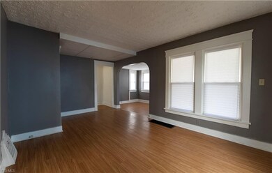 Inside the living room.  Front door foyer is direc