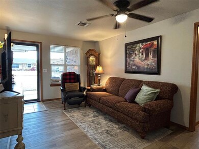Living room featuring a textured ceiling, ceiling 